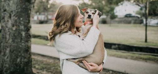 Woman holding dog