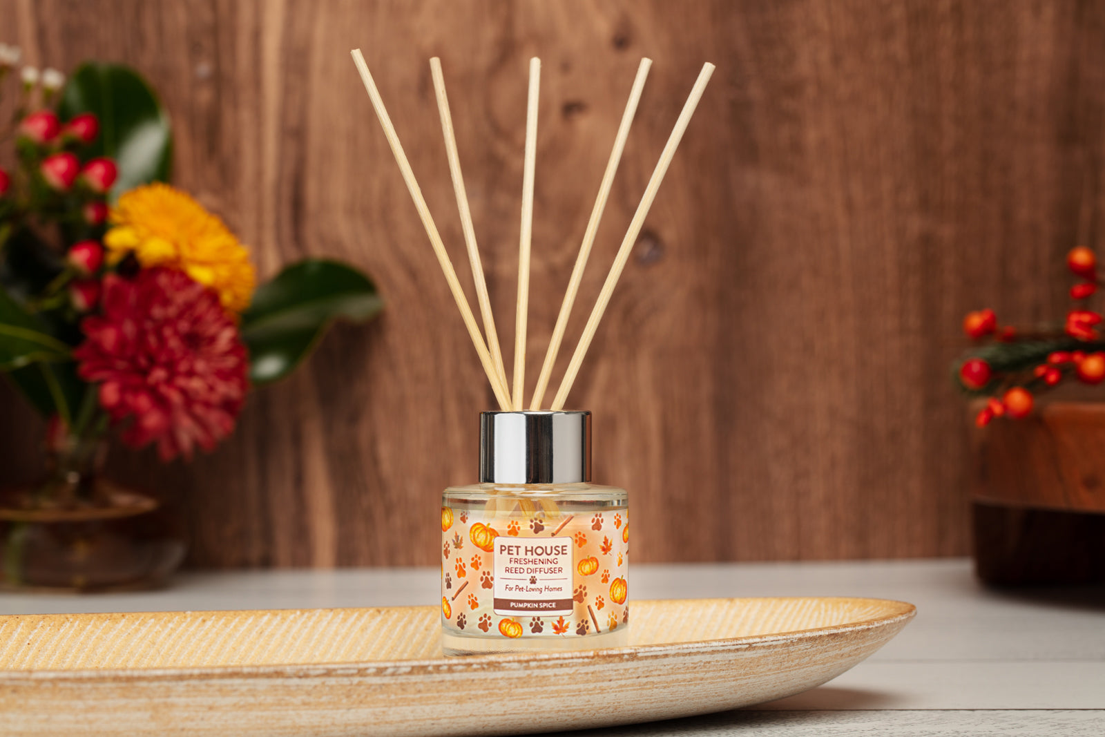 Pumpkin Spice Reed Diffuser on top of a wooden plate